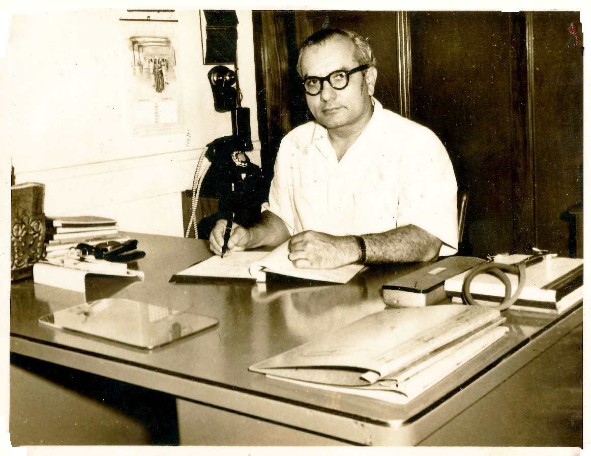 Dr. Dinshah Mehta at his desk during the trust foundation years