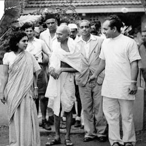 Dr. Dinshah Mehta walking with Mahatma Gandhi